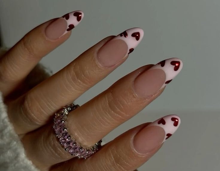Valentine's nail inspo pink french with red chrome hearts