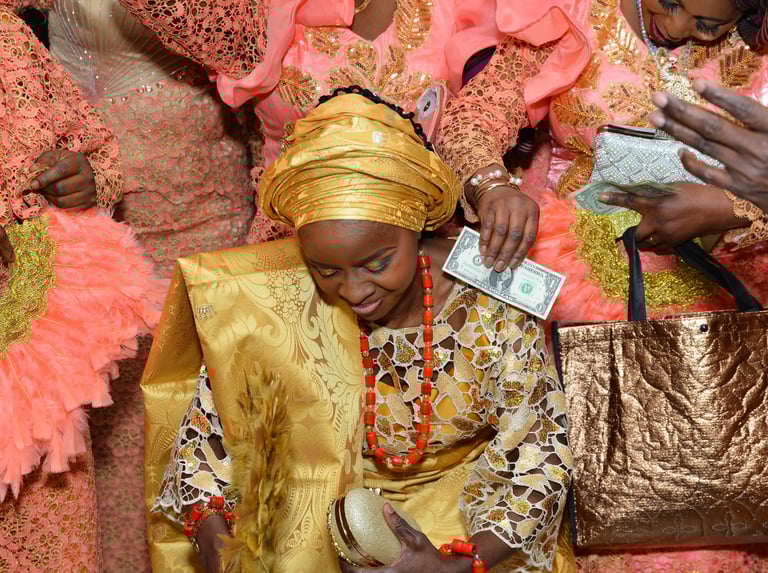 a woman in a gold dress and a gold purse