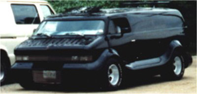 a creepy black van parked in a parking lot