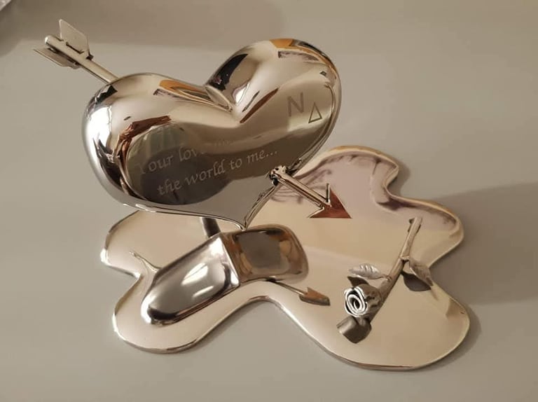 Polished metal love heart engraved with a personal message
