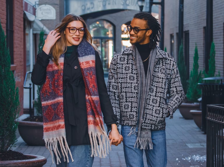 A happy couple walking through the shops at Fort Collins