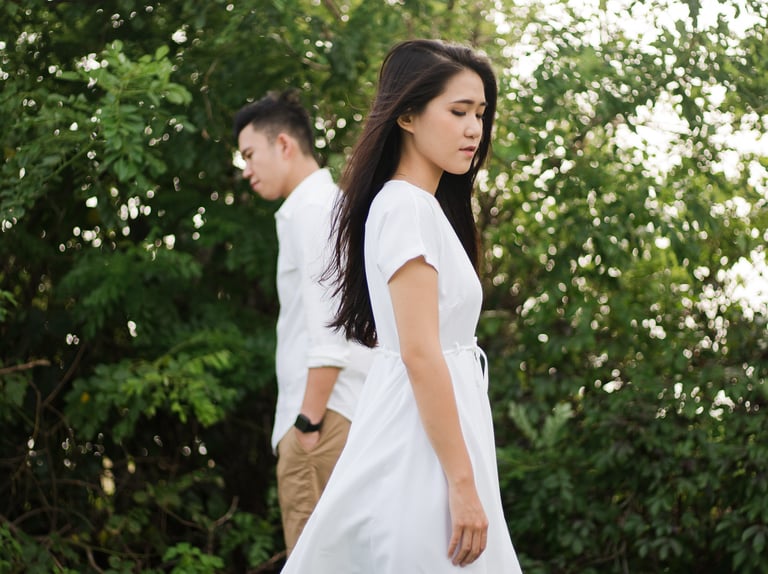 Couple walking near greenery during proposal photoshoot at Melasti Beach Bali