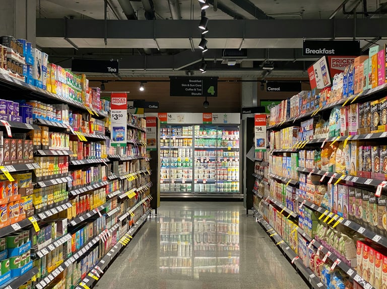 a grocery store aisle with a variety of products