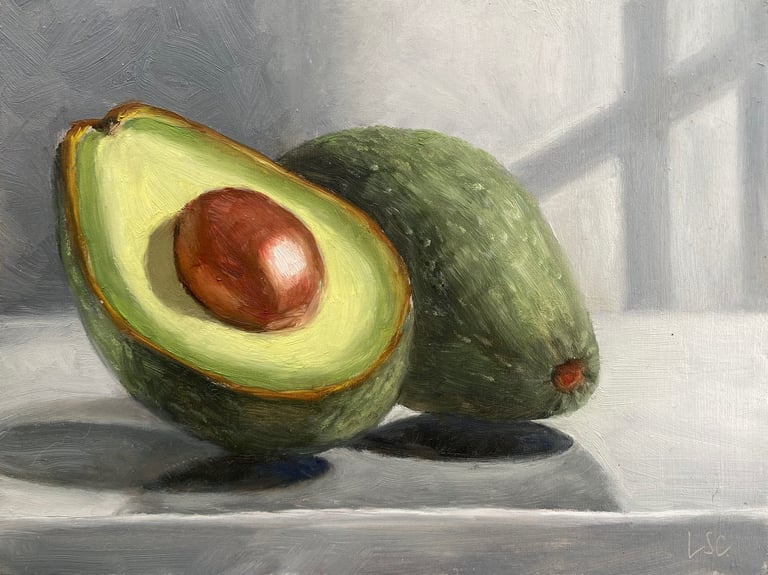 An original oil painting of avocado halves in the sunlight