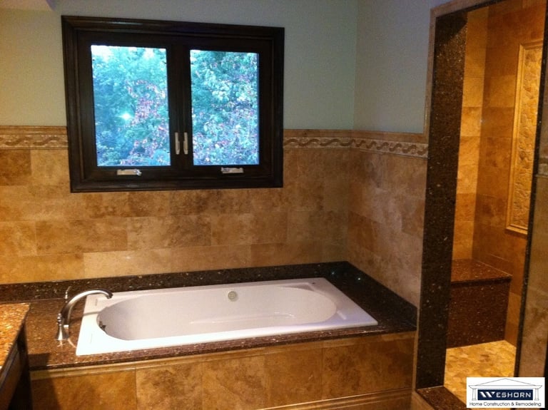 After tile installation, custom build shower, lighting update. Bathroom remodeled in Mount Prospect