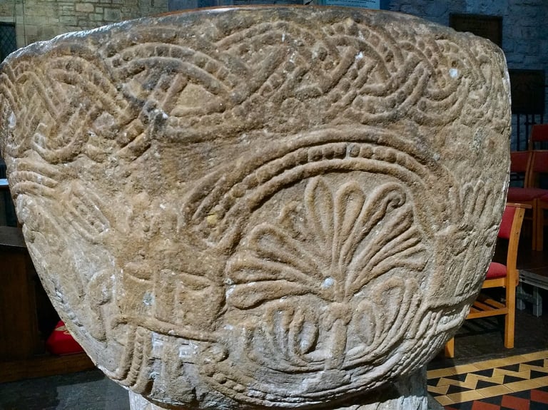Another side of the baptismal font at the Brecon Church showing a tree of life.