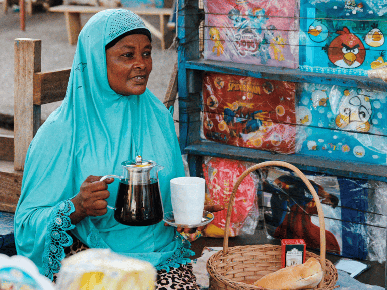 a woman in a blue hijab wearing a blue hijab