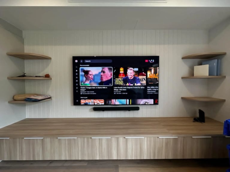 Professional 85 inch LG OLED TV wall mount installation with floating shelf in Brighton Melbourne