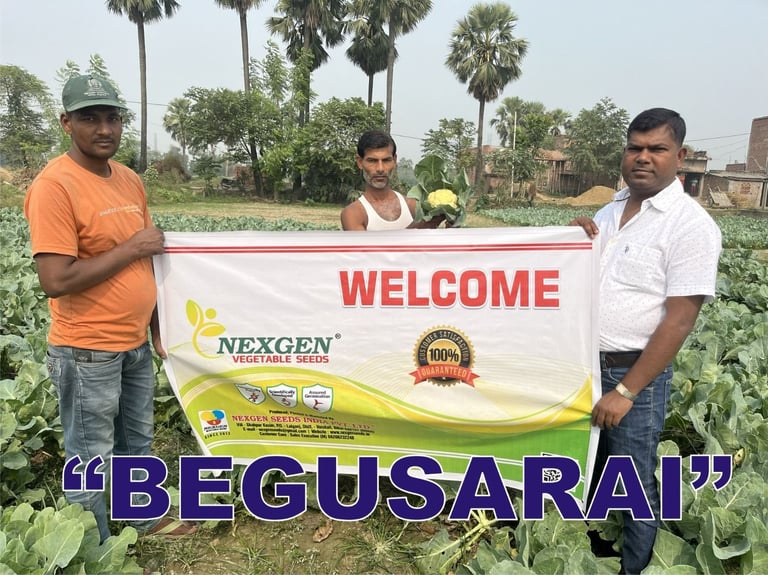 a group of men standing in a field with a banner that says welcome to the