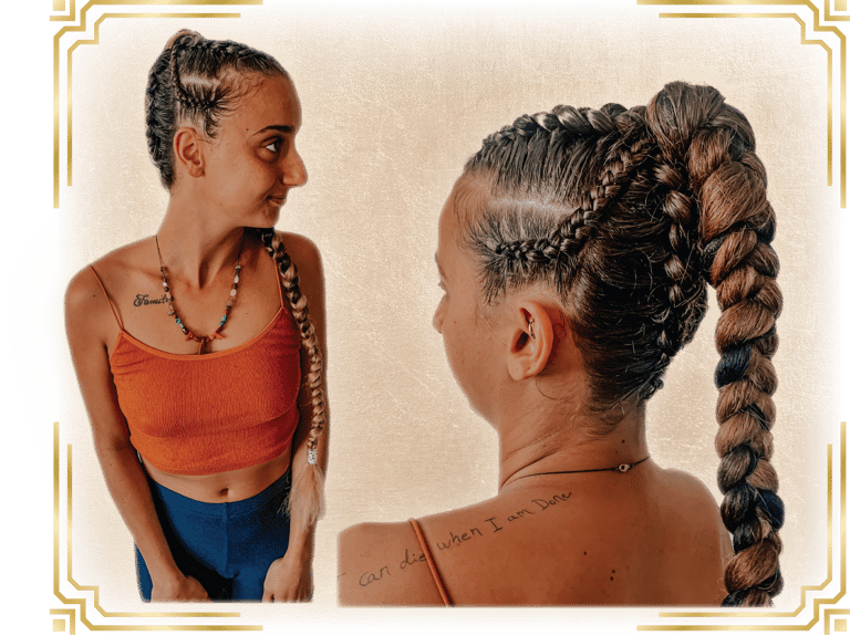 a woman with her hair done for a festival with braids and cornrows