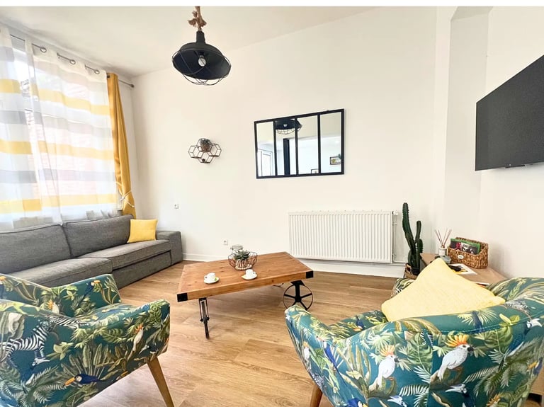 Cozy lounge with TV and sofa for business travelers on mid-term stays