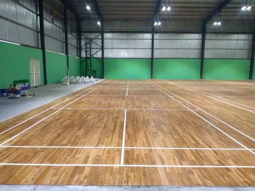 Indoor wooden badminton courts built with professional sports flooring