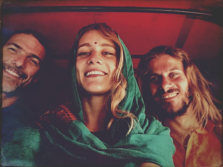 woman in a tuktuk with a green scarf in india