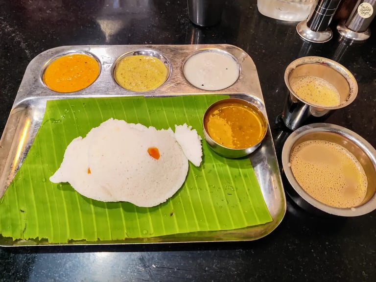 Traditional Tamil Nadu breakfast plate with idli, chutneys, and filter coffee