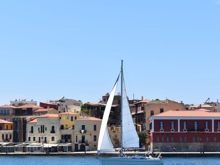a sailboat in the water in the chania port