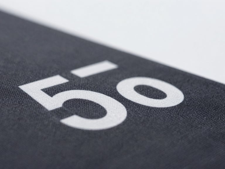Macro shot of a detailed DTF transfer on a dark fabric, sharp focus, clean texture, bright lighting