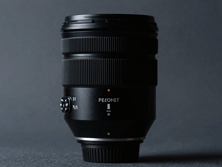 High-contrast commercial product shot for a luxury brand, minimalist architectural detail, sharp medium-format lens, editorial lighting, deep blacks and cool grays, off-center composition.