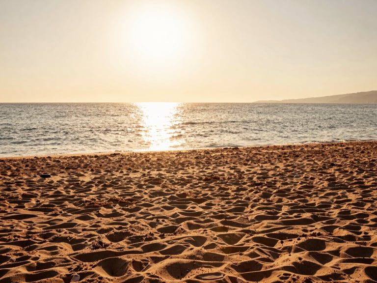 Editorial photography, wide sandy beach in Gela Sicily, low golden-hour sun reflecting on calm Mediterranean sea, terracotta-toned sand, high-end travel aesthetic