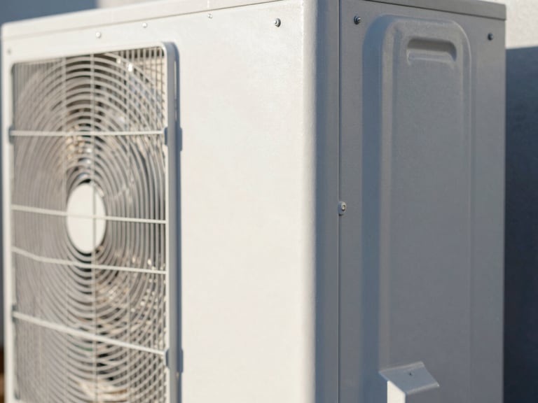 Macro shot of a high-end metal heat pump exterior, clean industrial design, crisp morning daylight with sharp shadows, 35mm lens