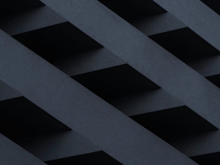 Abstract architectural geometry, dark, angular, fragmented, minimalist fine art photography, high-contrast cool ambient lighting, deep graphite tones, sharp architectural lines, 35mm lens