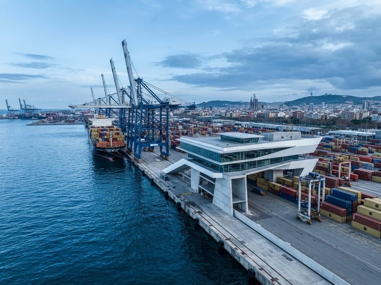 Wide-angle architectural photograph of a modern deep-water port terminal in Barcelona, cool daylight, high-contrast industrial realism, blue tones