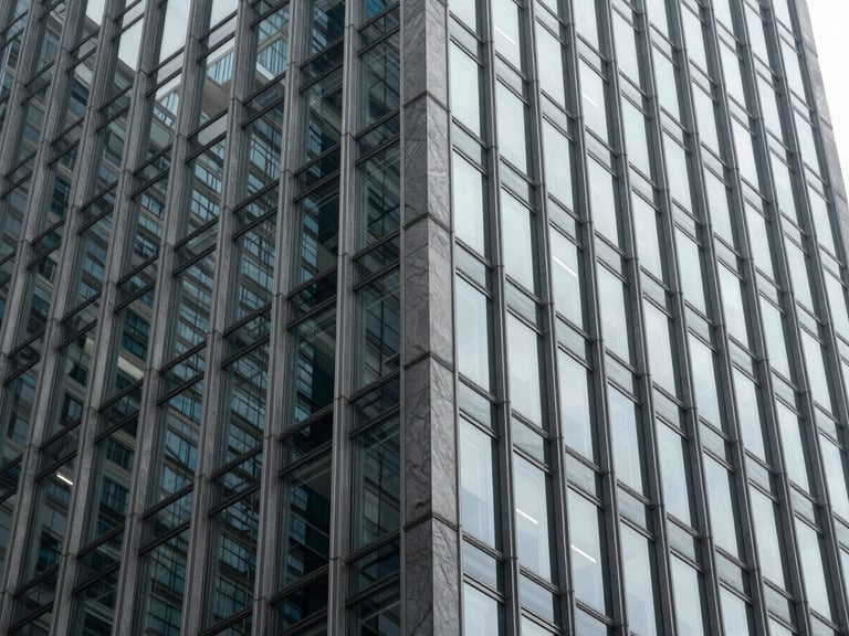 Abstract close-up of a modern steel and glass skyscraper facade, sharp architectural angles, cool diffused daylight, high contrast shadows