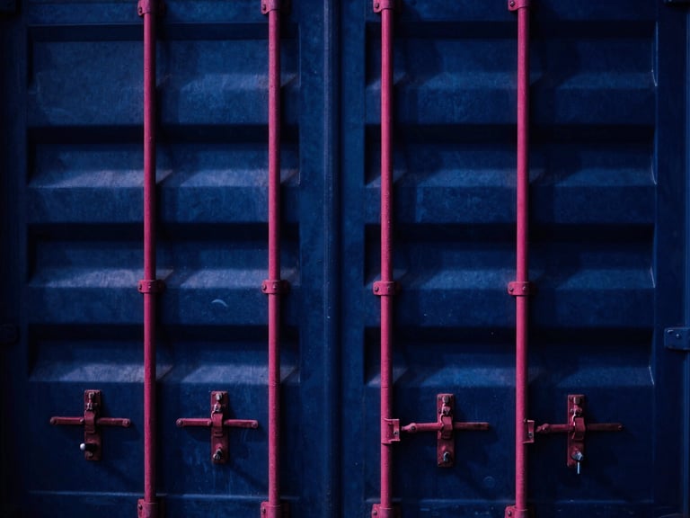 High-contrast close-up of shipping container locks and seals at a busy Jakarta port, dramatic industrial lighting with deep blue shadows and sharp magenta accents, 35mm
