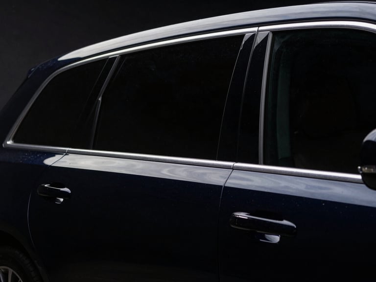 Low-angle heroic car portrait, rear windows with a very dark limo tint, sharp LED reflections, deep glossy paint, dark low-key automotive photography, 50mm