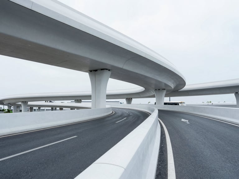 Clean architectural photography of modern transit routes and highway curves under cool daylight, minimalist composition, sharp focus, 35mm