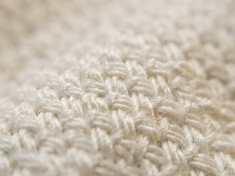 Extreme close-up macro shot of premium white cotton weave, showing high-density threads, soft warm natural morning light, shallow depth of field, minimalist luxury editorial style