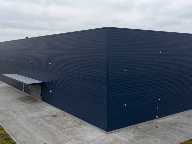 High-angle geometric composition of a modern organized logistics hub with clean architectural lines, cool overcast daylight, desaturated navy tones, sharp focus, 35mm.