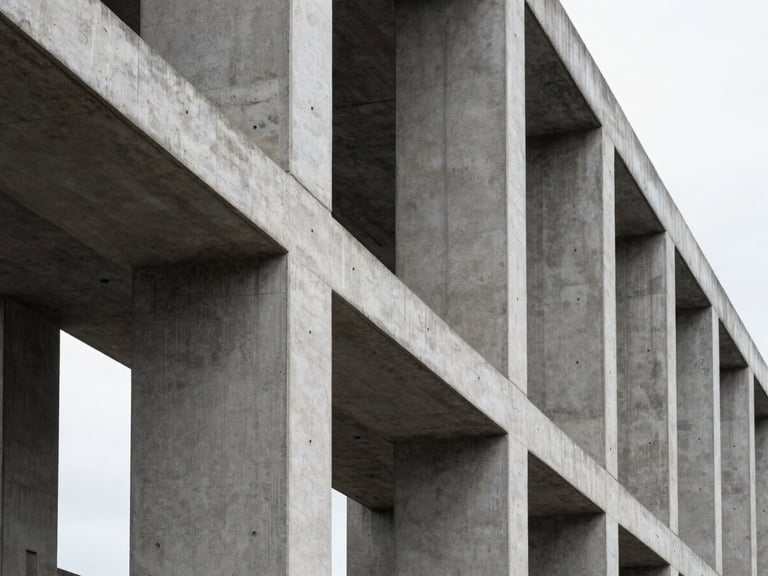 High-contrast architectural perspective of structural concrete and steel columns under overcast daylight, sharp clean lines, minimal composition.