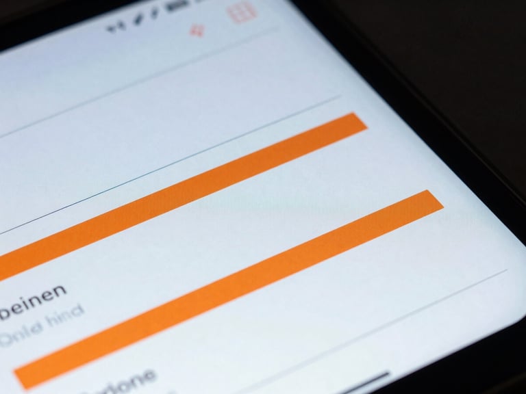 Macro close-up of an Android phone screen displaying a clean blueprint-style user interface with safety orange accents, high-contrast studio lighting, sharp technical shadows