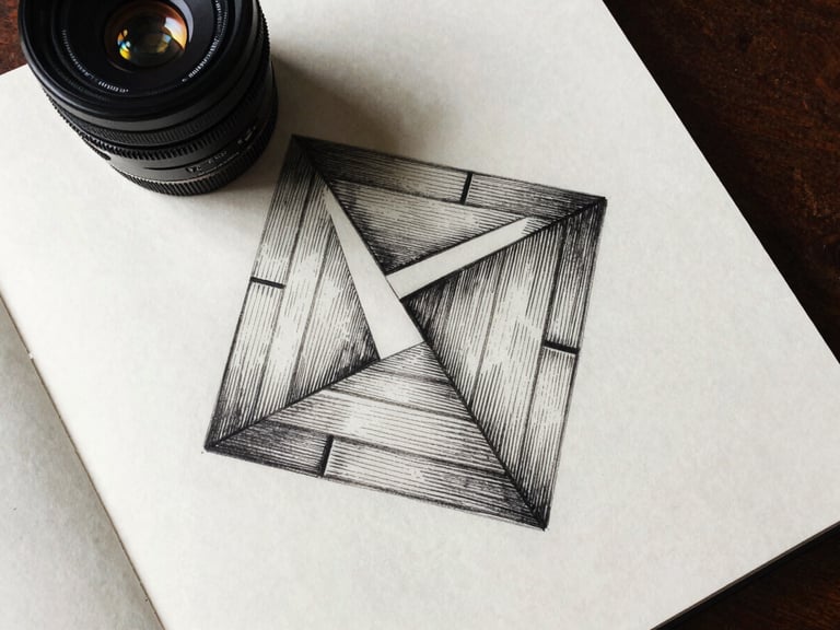 Overhead flat-lay of a geometric ink drawing on heavy cotton paper, natural side-lighting, sharp dark shadows, scholarly study setting.