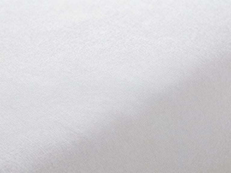 Macro texture of crisp white cotton bedsheets, bright neutral daylight, sharp focus on the tight percale weave