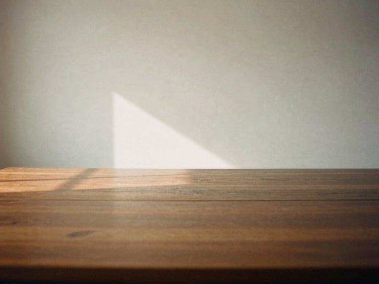 An empty, quiet meeting room with a dark wood table, soft shadows, warm natural light, minimalist composition, 35mm