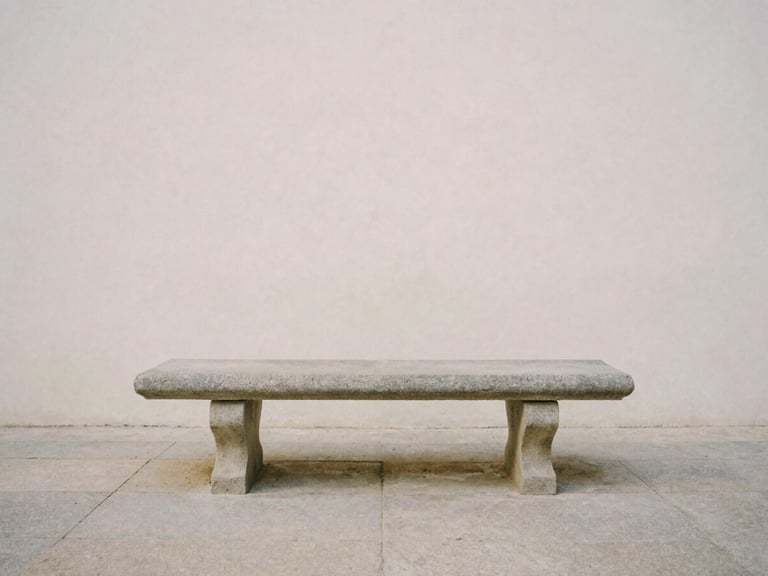 A solitary stone bench in a quiet classical courtyard, soft morning mist, minimalist composition, contemplative atmosphere