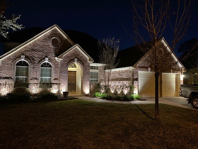 landscape lighting along front facade of house