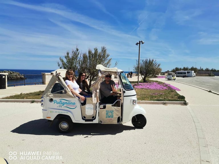 ape calessino with passengers on the coast
