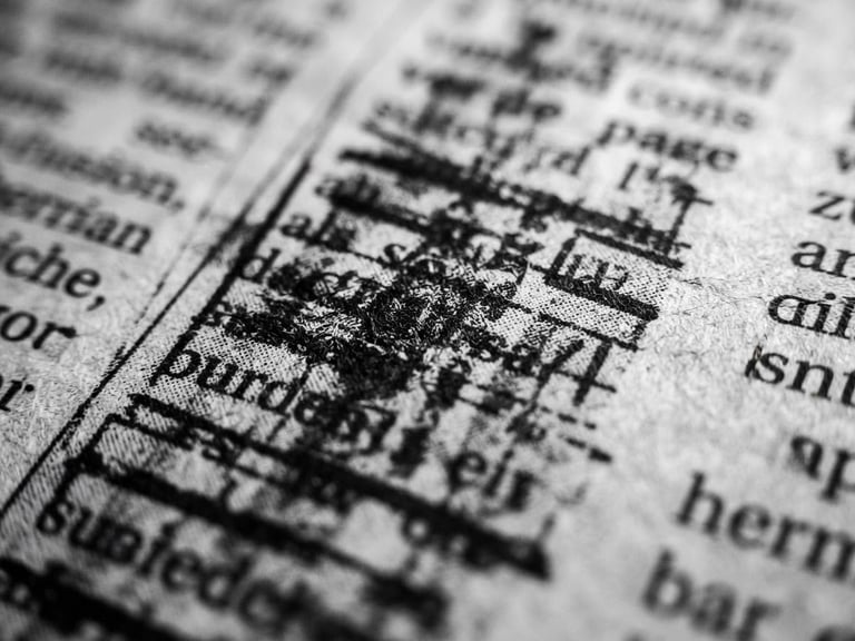 Crisp black and white macro shot of printed newspaper columns, deep shadows, sharp focus, editorial photography, 50mm lens