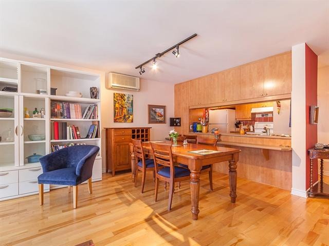 a dining room with a table and chairs