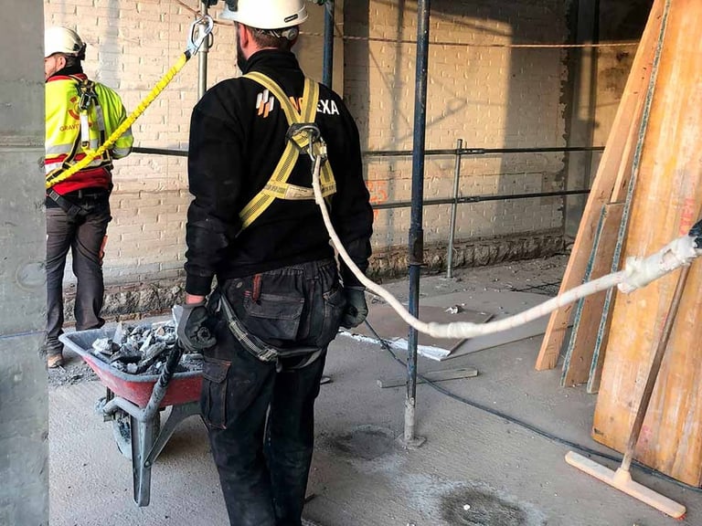 a man in a hard hat and a man in a hard hat