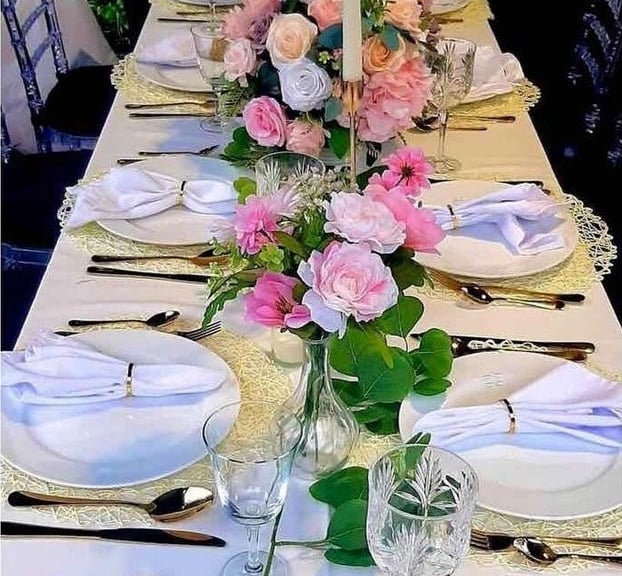 Backyard table setting for 20 guests, centerpieces , candles, tableware