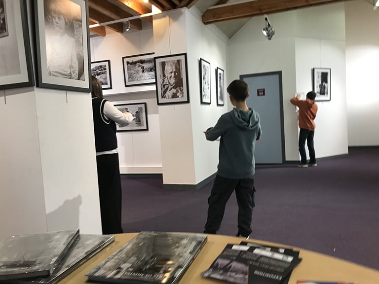 third photo of the art workshop students visiting the exhibition