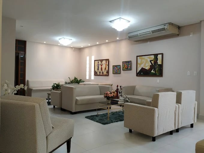 a living room with a couch and chairs