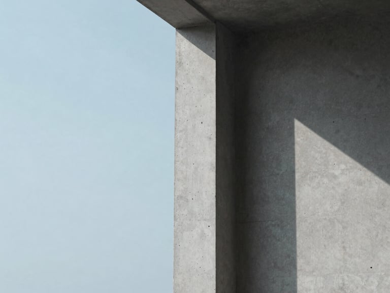 Minimalist architectural detail of a concrete column with soft overcast daylight casting long shadows, muted blue tones, clean composition, 35mm.