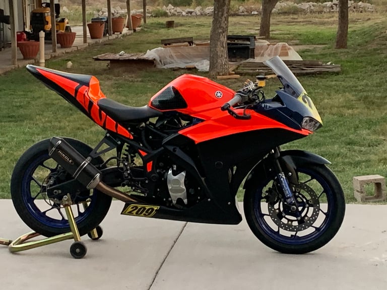 black and red race motorcycle. yamaha with matte black and red wrap. wrapped