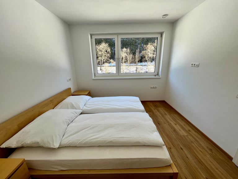 a bed with a bed and a window