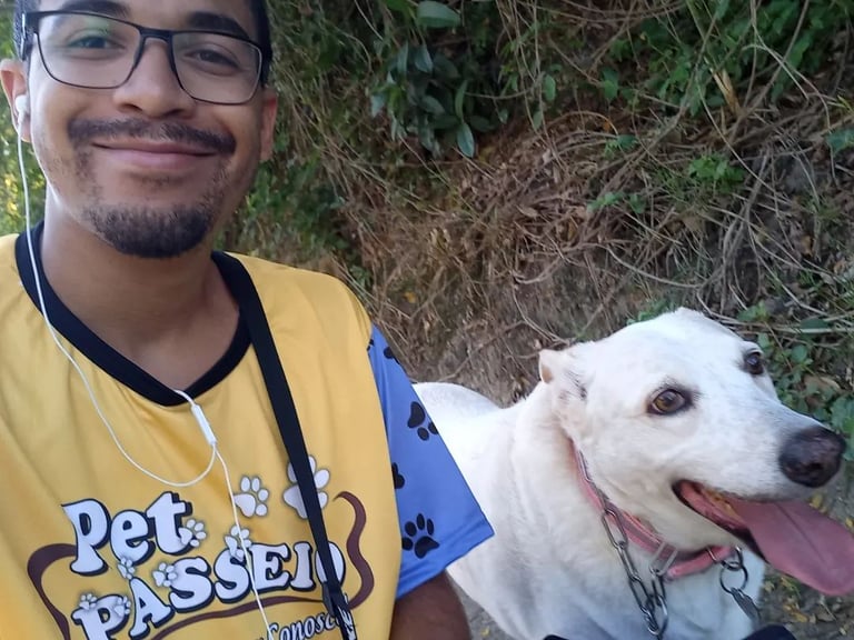 a man with a dog on a leash and a dog