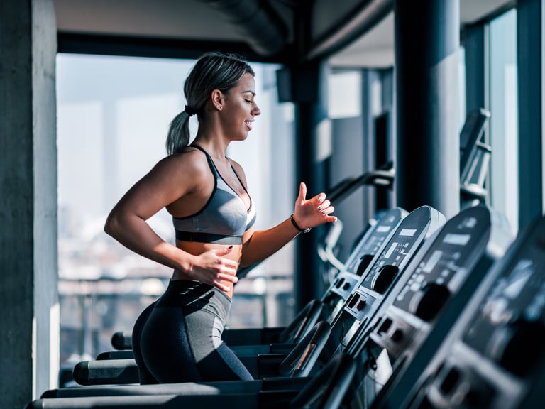 Girl Doing fitness on treadmill